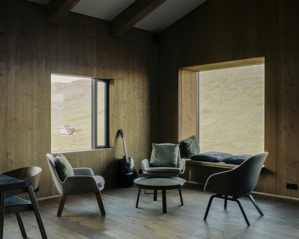 Lounge room with chairs and accoustic guitar