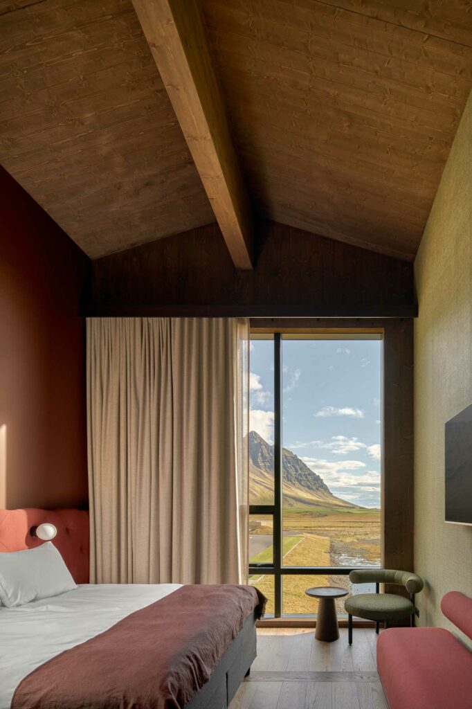High-end hotel room with high ceiling and large windows